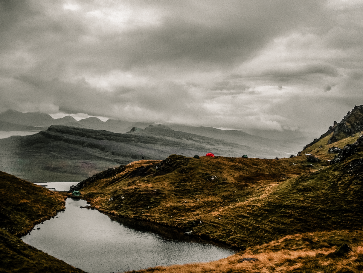 Wild camping beside a mountain loch on the Isle of Skye, Scotland.