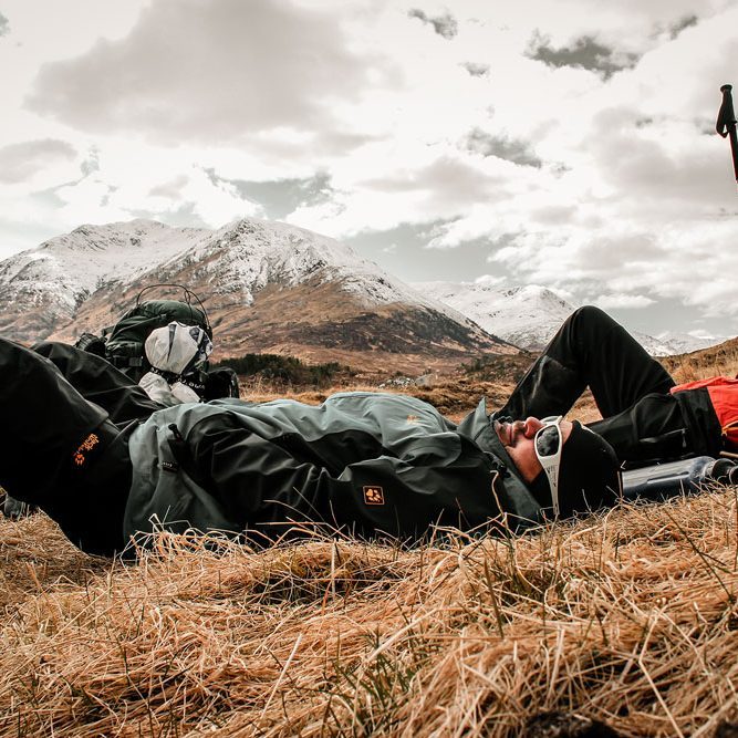 Hikers taking Hikers taking a well-earned rest in the mountains of Knoydart, Scottish Highlands.