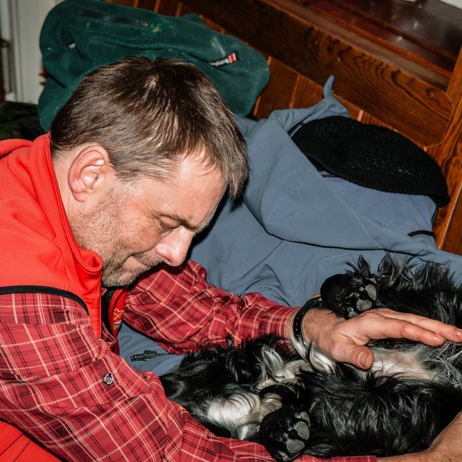 J. Jefferson J. Jefferson spending a quiet moment with a Border Collie during a journey through the Scottish Highlands.