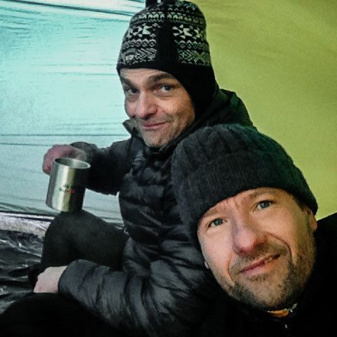 J. Jefferson J. Jefferson sharing a quiet evening inside a tent during a trekking expedition in the Scottish Highlands.